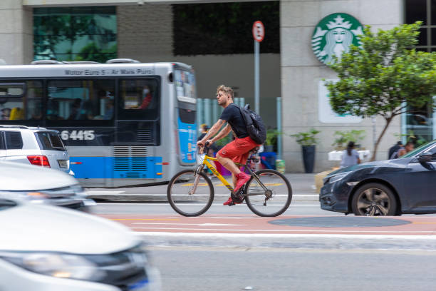 cyclists ride on the bike lane on Paulista avenue stock photo
