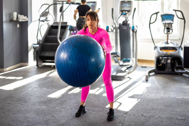 istock A young female athlete is doing a workout in a gym. 1385955310