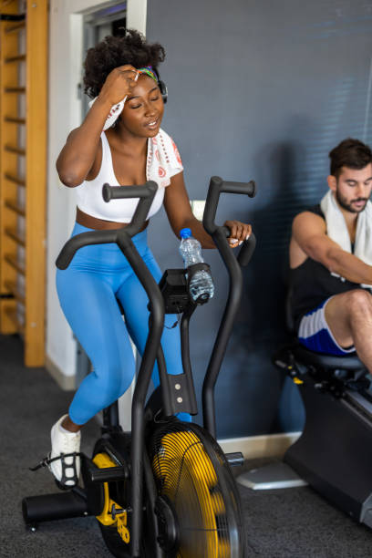 istock A young African female athlete is doing a workout in a gym using an exercise bike. 1385956517