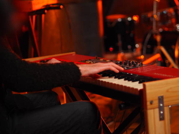 istock Musician Playing Keyboard Piano 1385956992