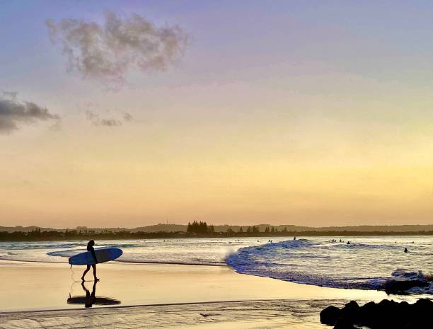 istock Silhouette of Ocean Surfer at Sunset 1385958389