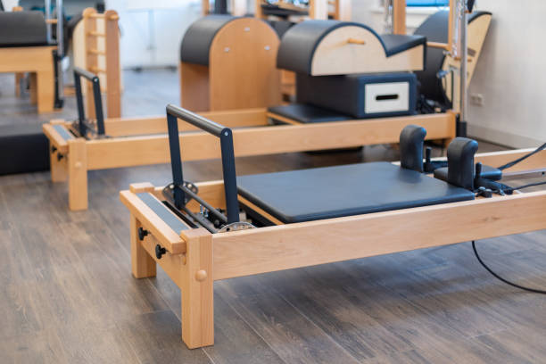 Fitness Pilates Stretch Tables And Other Exercise Equipment In Gym Stock  Photo - Download Image Now - iStock
