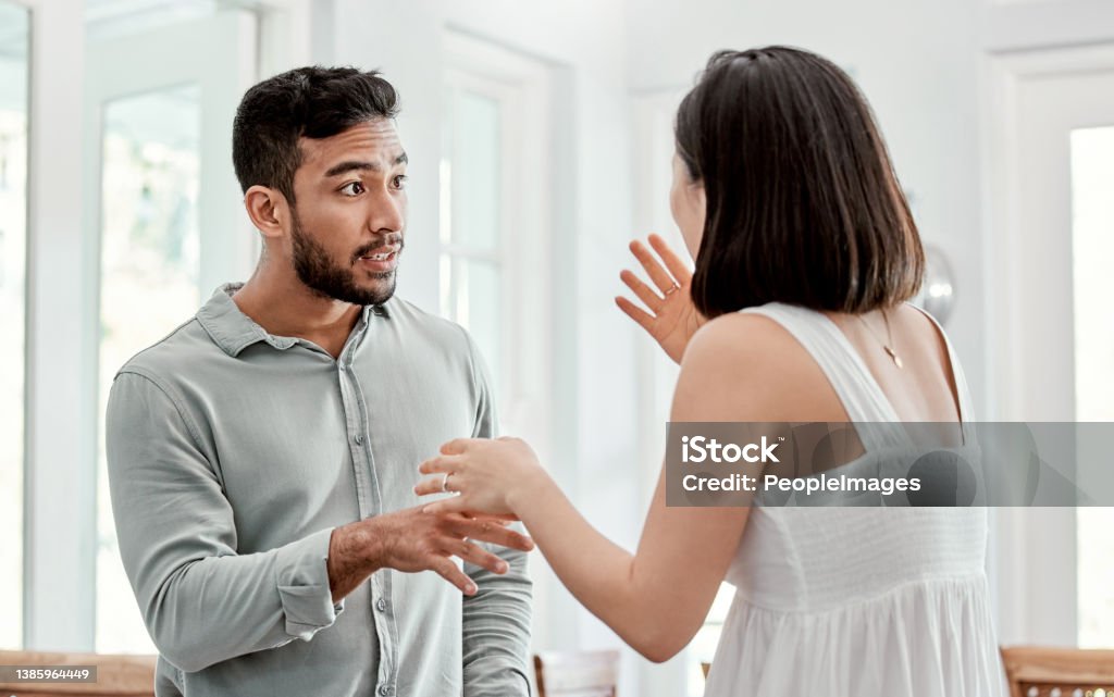 Shot of a young couple having an argument at home Compromise is a must Arguing Stock Photo