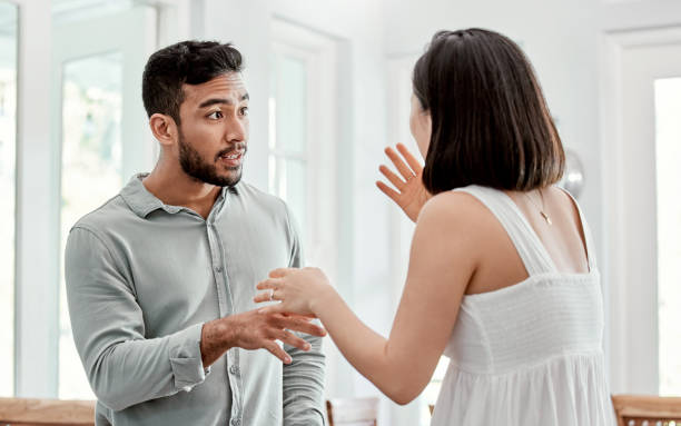 Shot of a young couple having an argument at home Compromise is a must husband and wife stock pictures, royalty-free photos & images