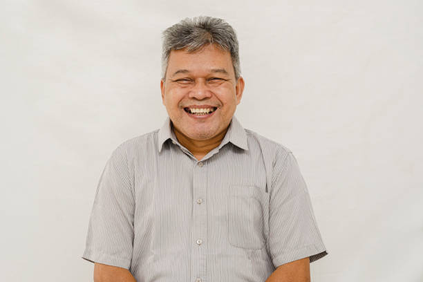 istock Happy Senior Man Studio Portrait 1385965388