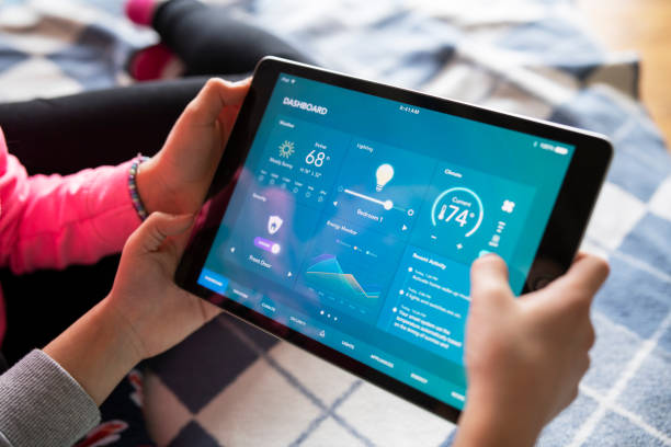 istock Young kids adjusting room lights via smart home control functions. 1385966728