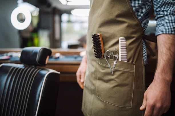 Close up of a unrecognisable barber's apron.