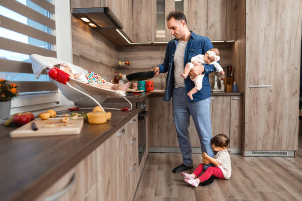 istock Happy family making pancakes in the kitchen 1385968096
