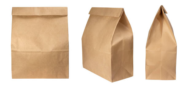 istock Brown paper bag isolated on white background with clipping path 1385968419