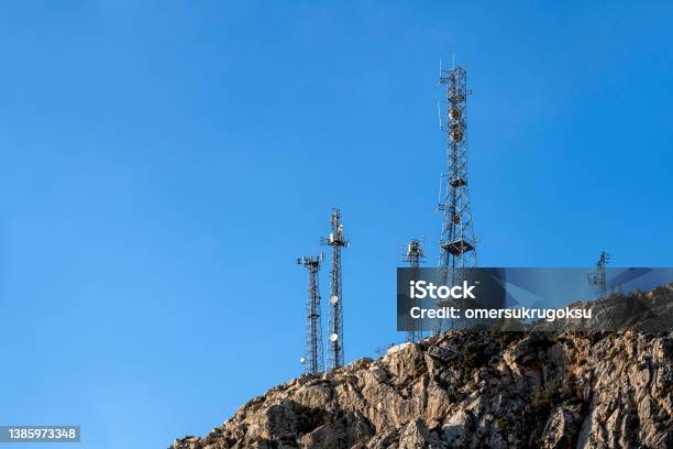 Base Station Antenna On Top Of Rocky Mountain Stock Photo - Download Image Now - Radio, Radio Broadcasting, Connection