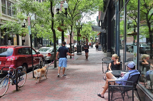 People visit downtown Providence. Providence is the capital and most populous city in Rhode Island with 182,000 citizens.