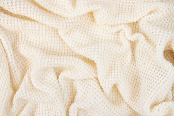 istock Light fabric texture. Background with folds. Close-up. 1385973792