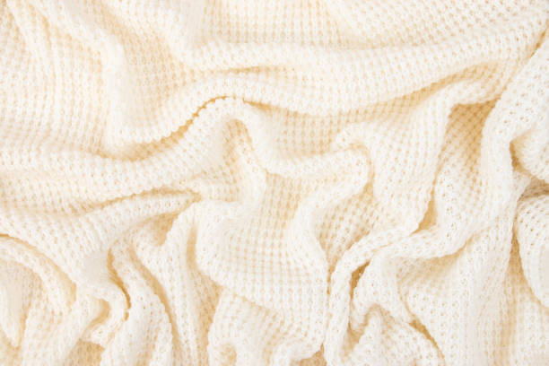 istock Light fabric texture. Background with folds. Close-up. 1385973870