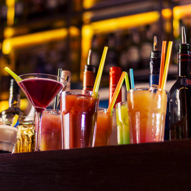 istock colorful coctails on wooden bar table 1385974170