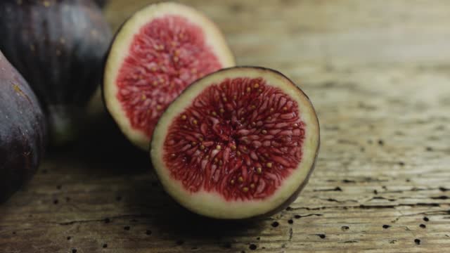 Some freshly picked figs on a wooden background