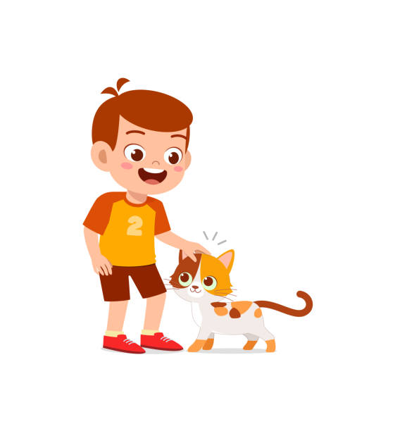 mały chłopiec bawiący się razem z uroczym kotem - humor pets loving vertical stock illustrations