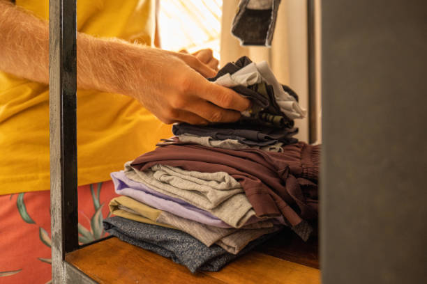 istock Close up on man packing clothes for a trip 1385978526