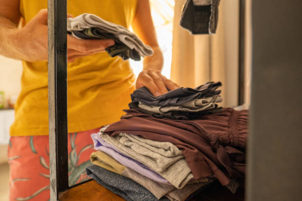 istock Close up on man packing clothes for a trip 1385978574