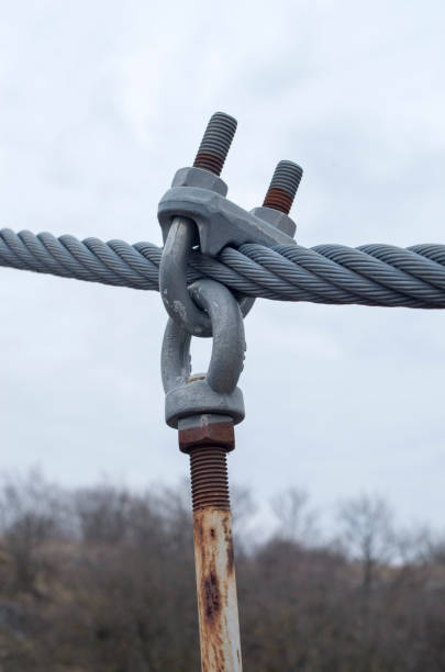 istock New steel braided rope and old rusty bracket on bridge 1385978830