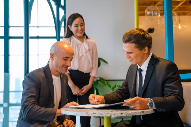 istock International business person. Making agreement and celebration. 1385980444