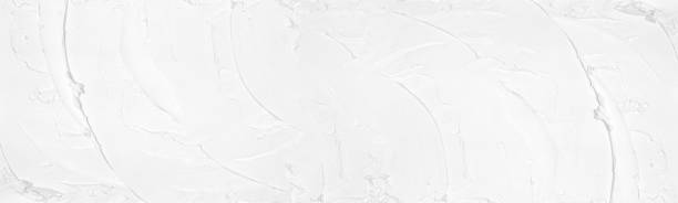 Smears of white plaster wide large texture. Light putty strokes pattern. Abstract whitewashed widescreen background Smears of white plaster wide large texture. Light putty strokes pattern. Abstract whitewashed widescreen background putty stock pictures, royalty-free photos & images