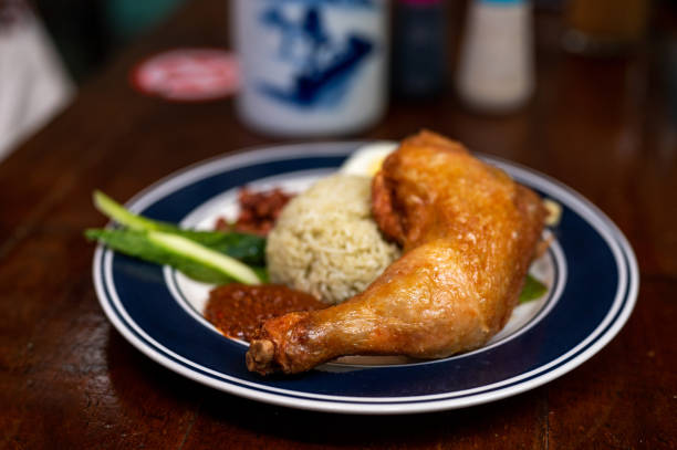 istock Nasi Lemak (Coconut Milk Rice) with Fried Chicken and  Side Dishes 1385980905