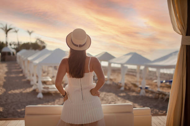Happy woman on honeymoon enjoying sunset. (Soft focus)