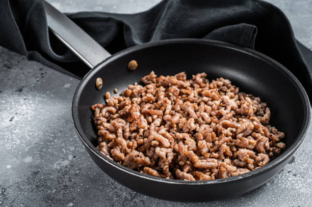 istock Pan fried minced meat to Italian pasta. Gray background. Top view 1385982684