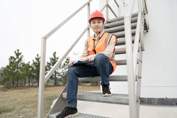 istock A young Asian male engineer is working on wind power. 1385982738