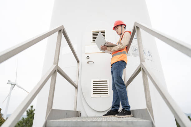 istock A young Asian male engineer is working on wind power. 1385983278