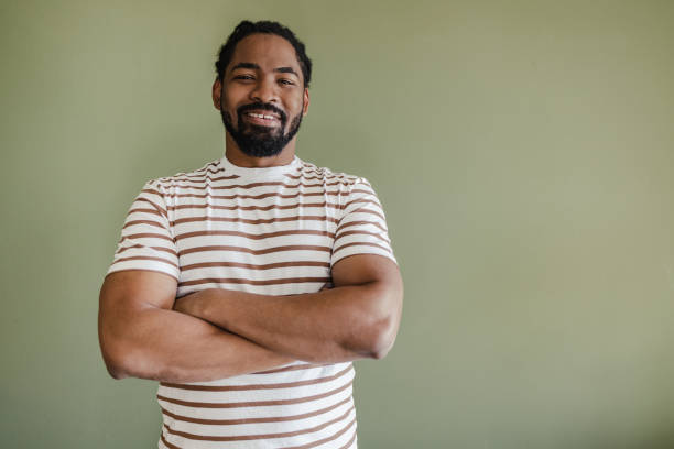 istock Confident African American man against green background 1385983384