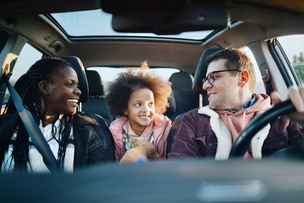 istock Parents And Daughter Enjoying Auto Ride Together On Weekend 1385985452