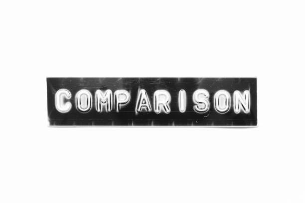 istock Embossed letter with word comparison in black banner on white paper background 1385985599