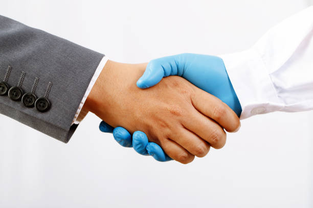 Businessman shaking hands with a doctor