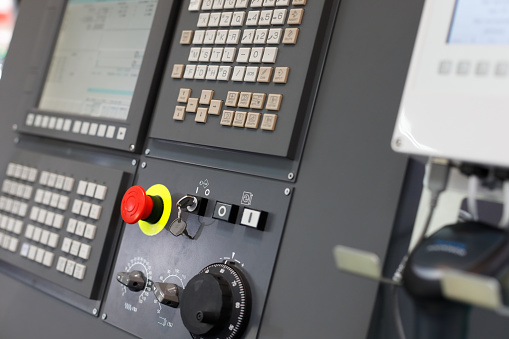 CNC control panel of a machining center close up. Selective focus.