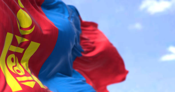 detail of the national flag of mongolia waving in the wind on a clear day - independent mongolia fotos imagens e fotografias de stock
