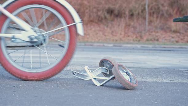 istock Young Kid Learning To Ride a Bike without Support Stabilizer Wheels Left Behind 1385995627