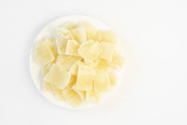 istock Healthy organic dessert: dried (dehydrated) Aloe Vera chunks on white background, flat lay, copy space. Horizontal plane. Healthy food for the whole family. 1386001174
