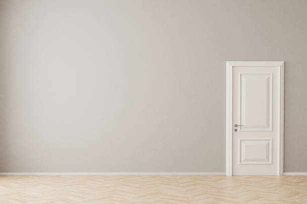 An empty apartment with hardwood floor, wall, door. Mockup for interior.