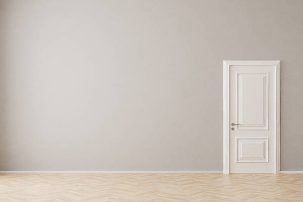 An empty apartment with hardwood floor, wall, door. Mockup for interior. stock photo