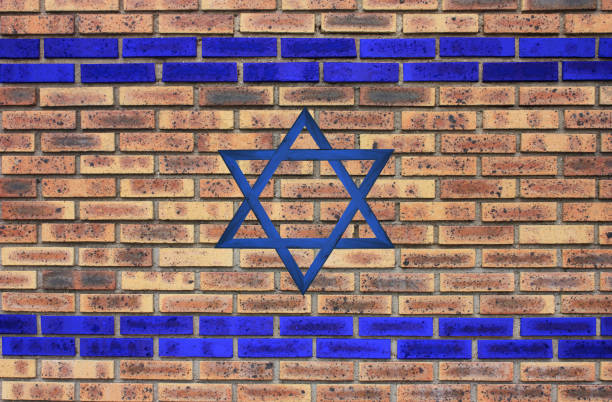 istock Israeli flag on a brick wall background 1386001417