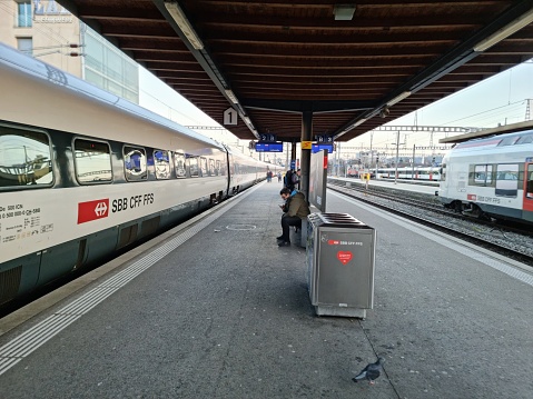 Biel /Bienne Railway Station platform with a Train awaiting for departure. The image was captured during spring season after sunset.