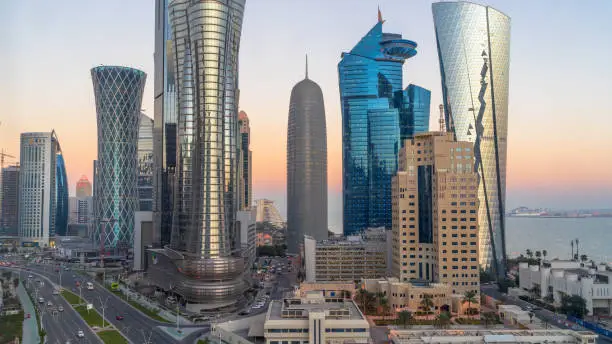 Doha, Qatar- March 03,2022 : Qatar skyline during sunset with colorful sky.