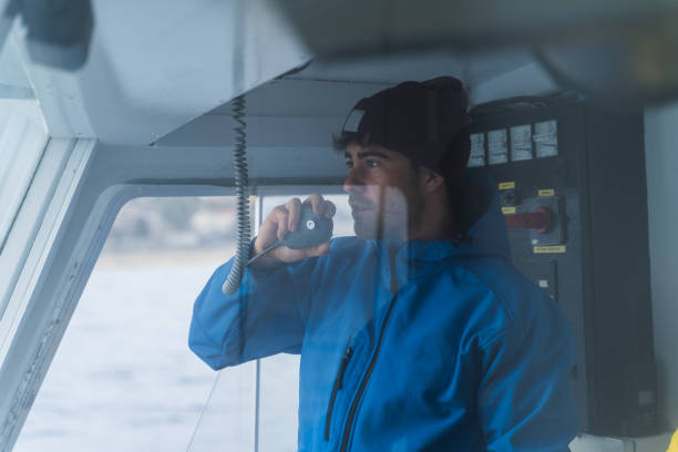 istock Crew member talking on the radio 1386009883