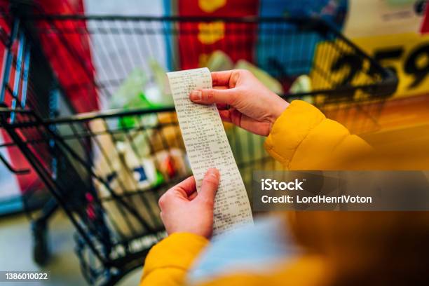 Checking The Bill Stock Photo - Download Image Now - Supermarket, Groceries, Shopping