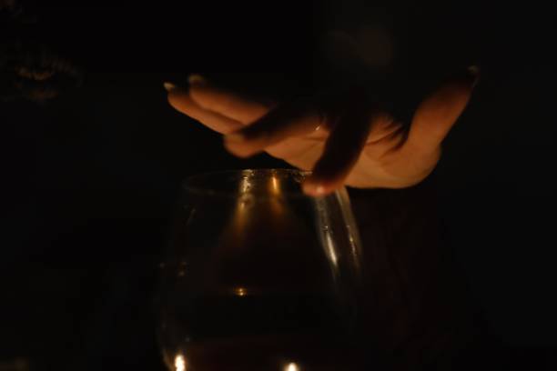 istock Hand holding glass of wine 1386018532