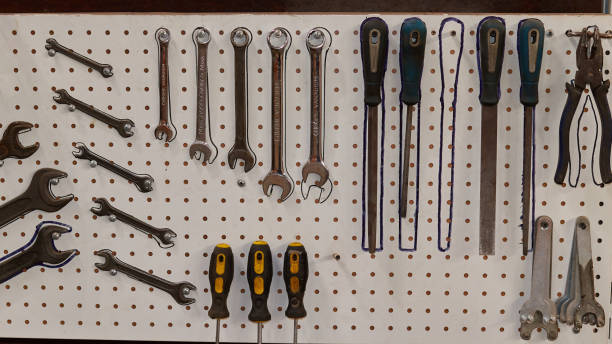 istock tools hanging on the stand. wrenches, screwdrivers, files and pliers 1386018673