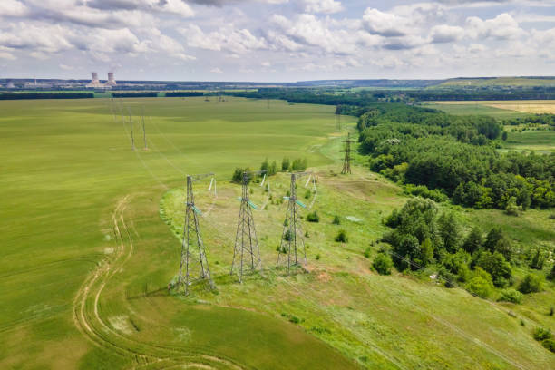 istock Transmission line in rural field 1386019798