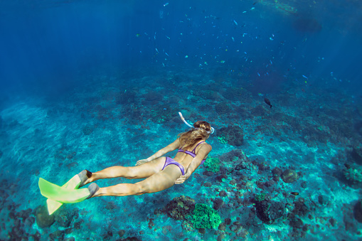 Young woman diving underwater photo