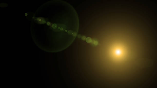 istock Easy to add lens flare effects for overlay designs or screen blending mode to make high-quality images. Abstract sun burst, digital flare, iridescent glare over black background. 1386027386